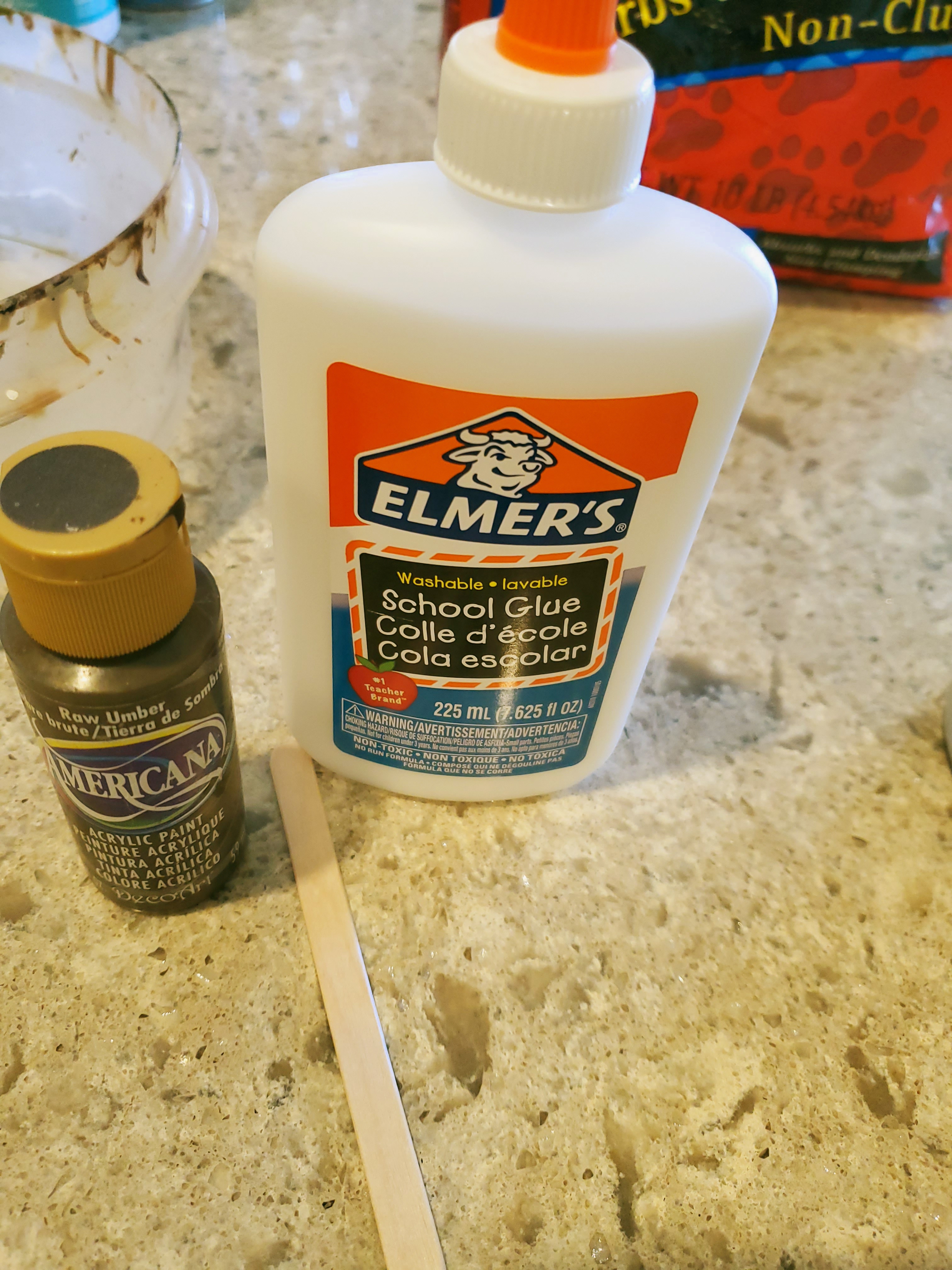 showing Elme's glue, brown craft paint and stick to mix