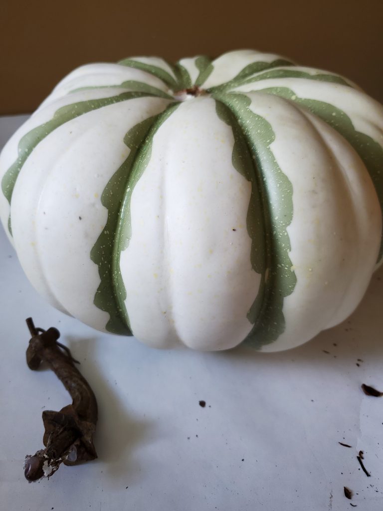 fake pumpkin I paint for decorating shelves for fall
