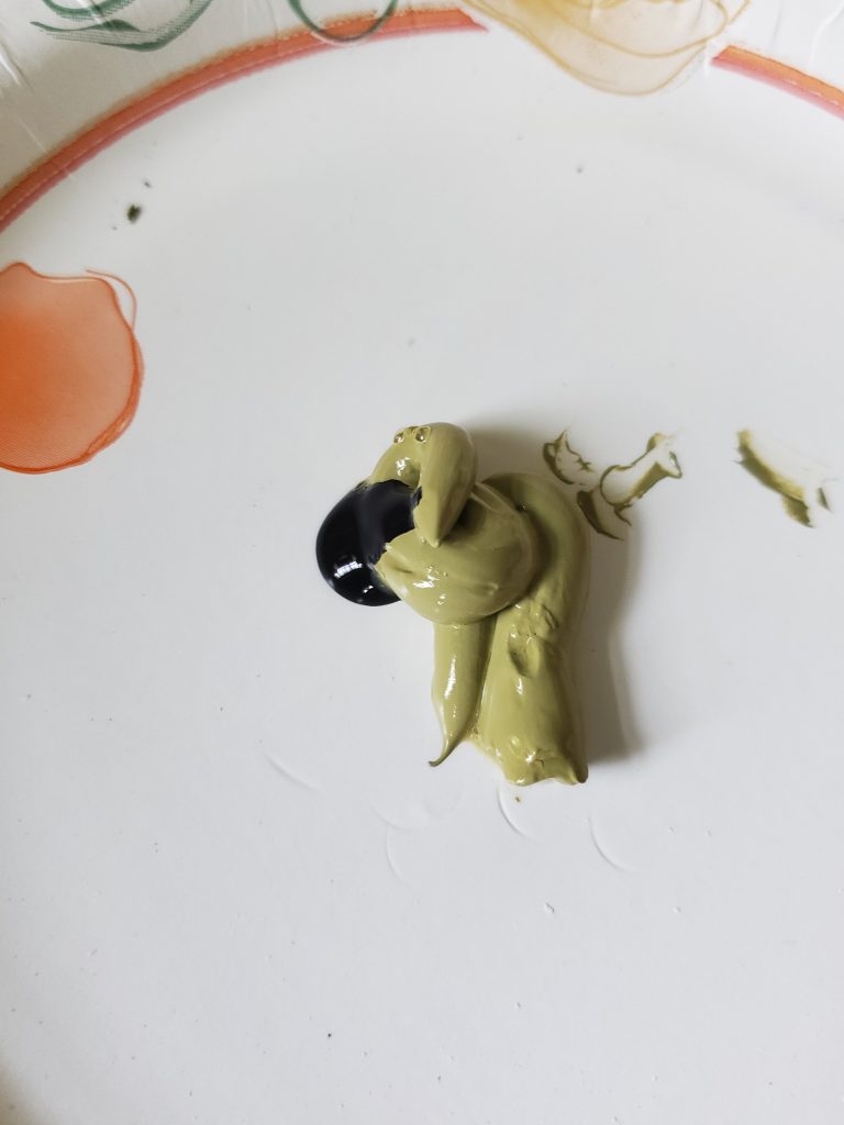 green and black paint to make dark green color