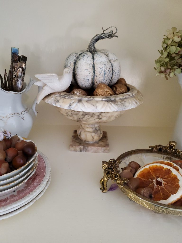 a shelf decorated for fall