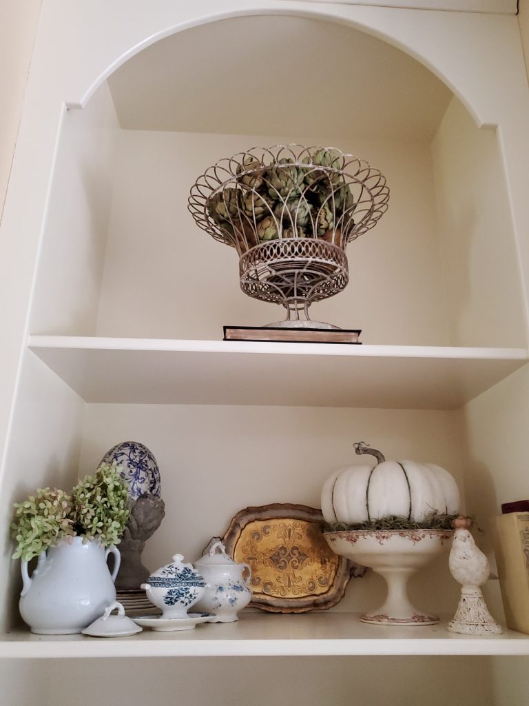 decorating the shelves for fall