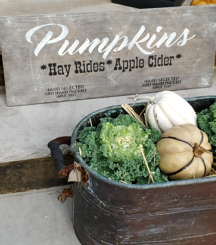 showing a fall sign on the decorated fall porch