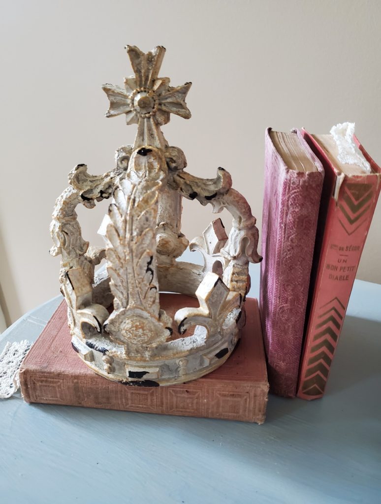 close up of crown and antique French books