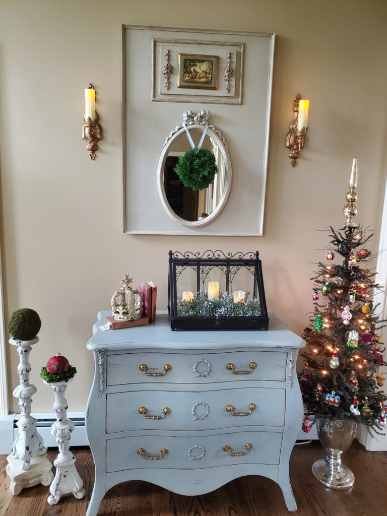 Christmas foyer sharing the tree, Bombay chest and large candle holders 