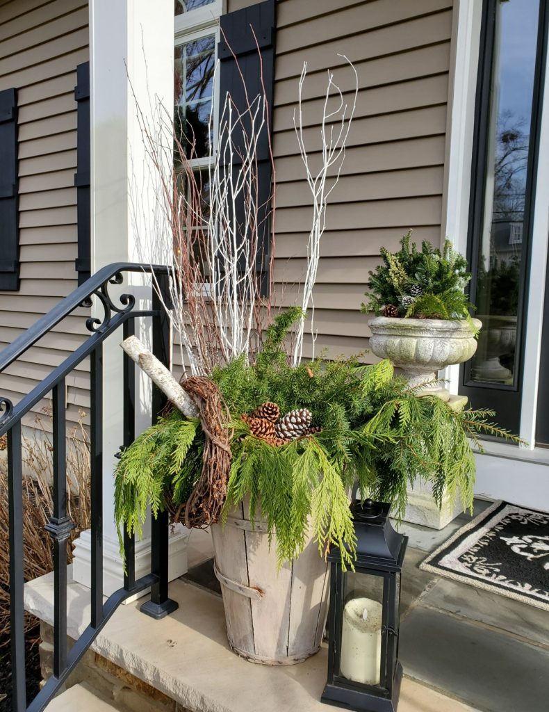 Christmas porches close up of bushel basket filled with greens