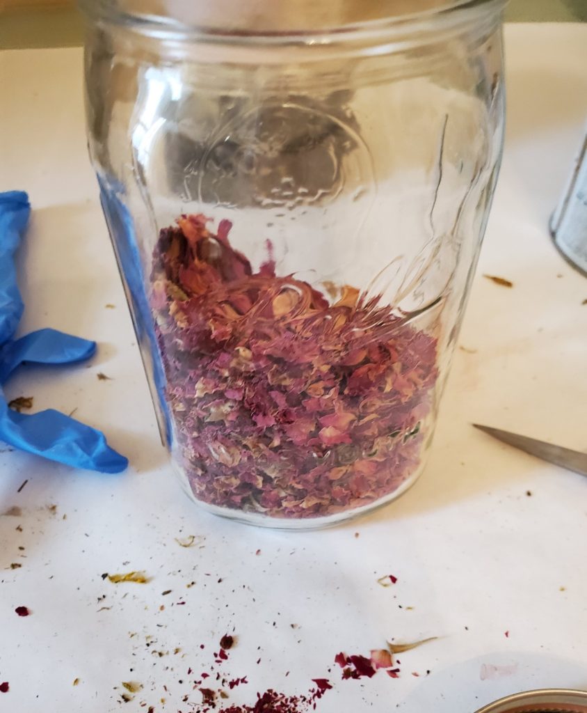 dried rose petals in a jar