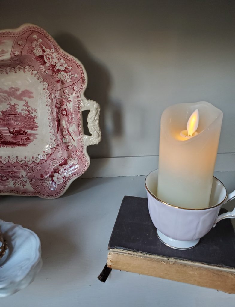 flameless candle and book