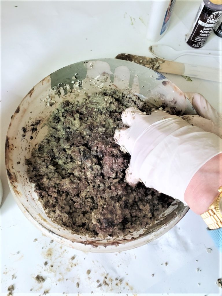grabbing-dirt-to-add-to-pot