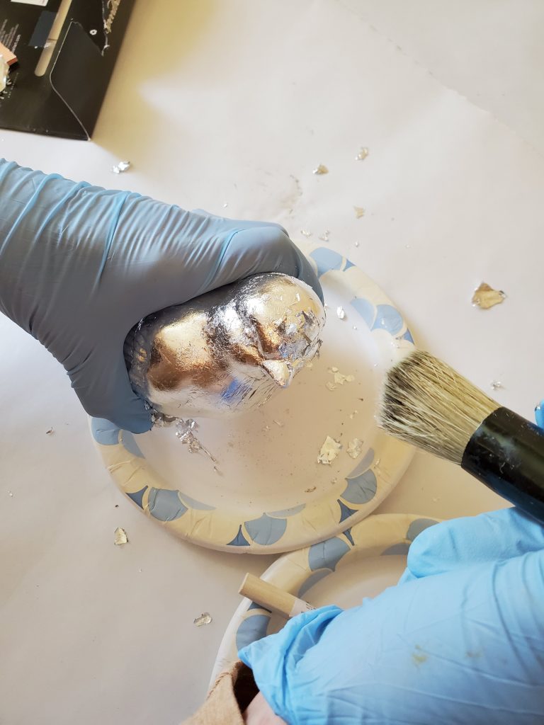 smoothing more silver leaf