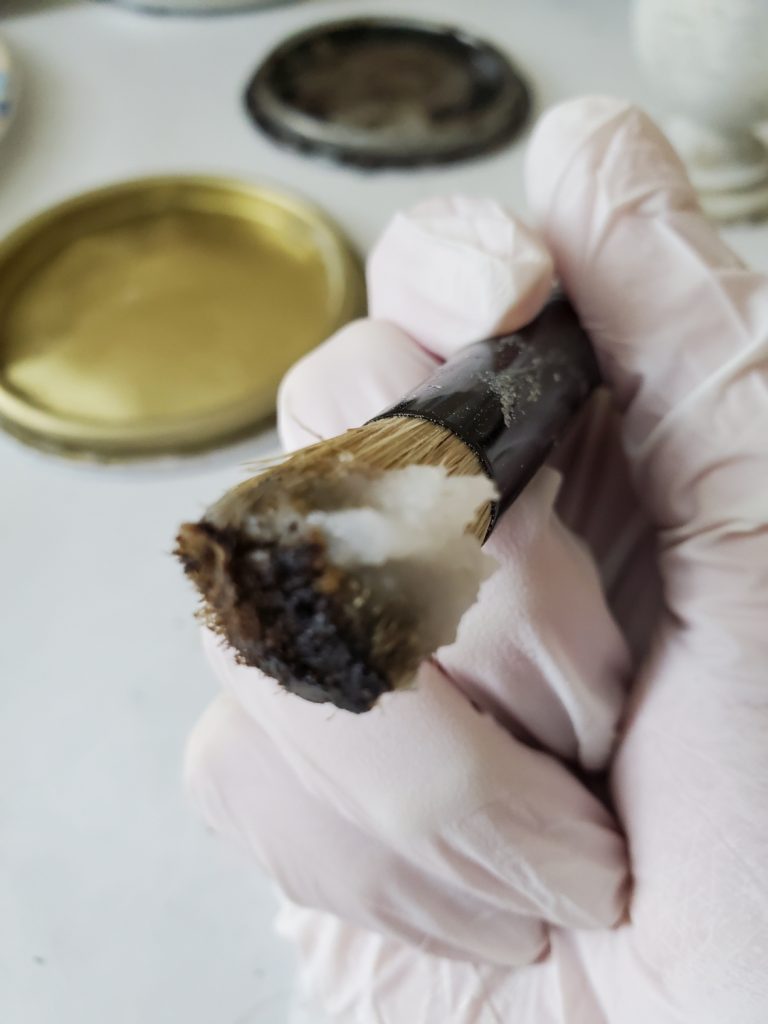 clear and dark wax on a brush