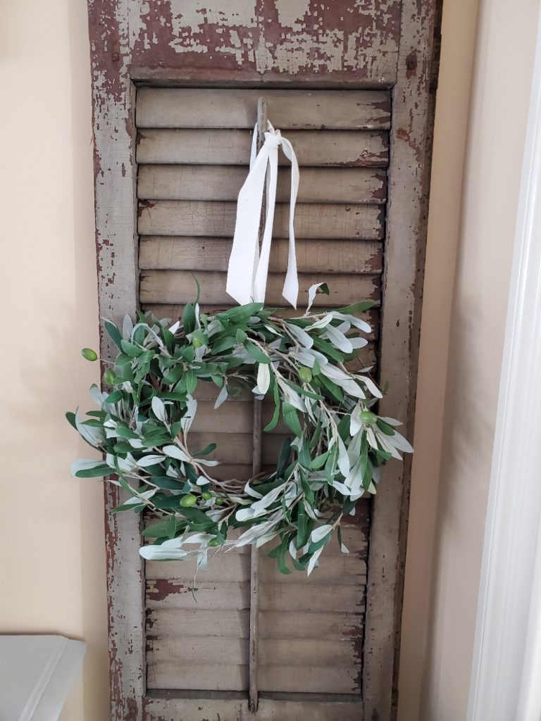 finished easy wreath hanging on a shutter