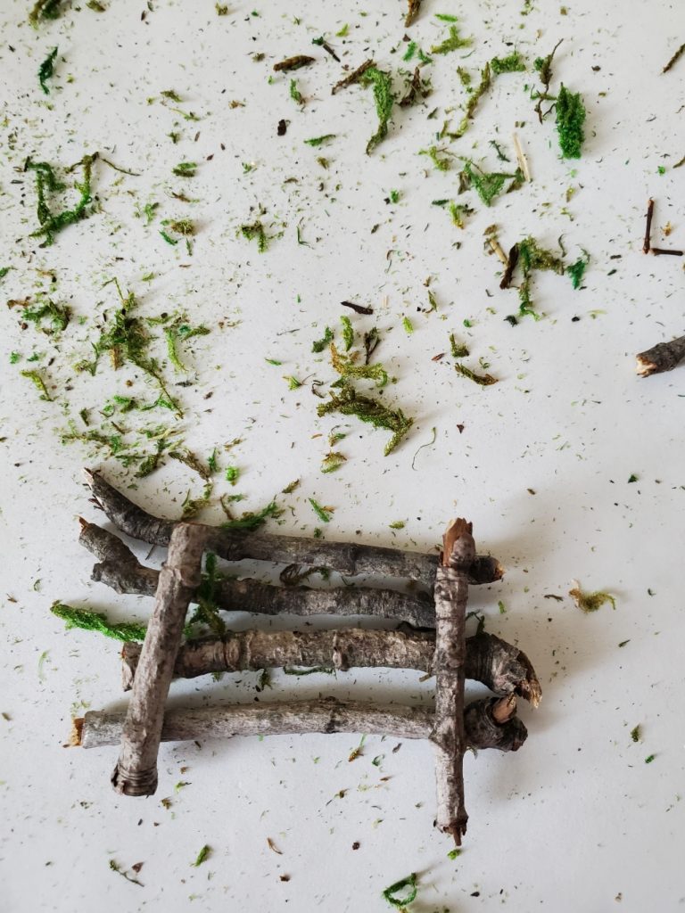 glued small sticks to make a small nest