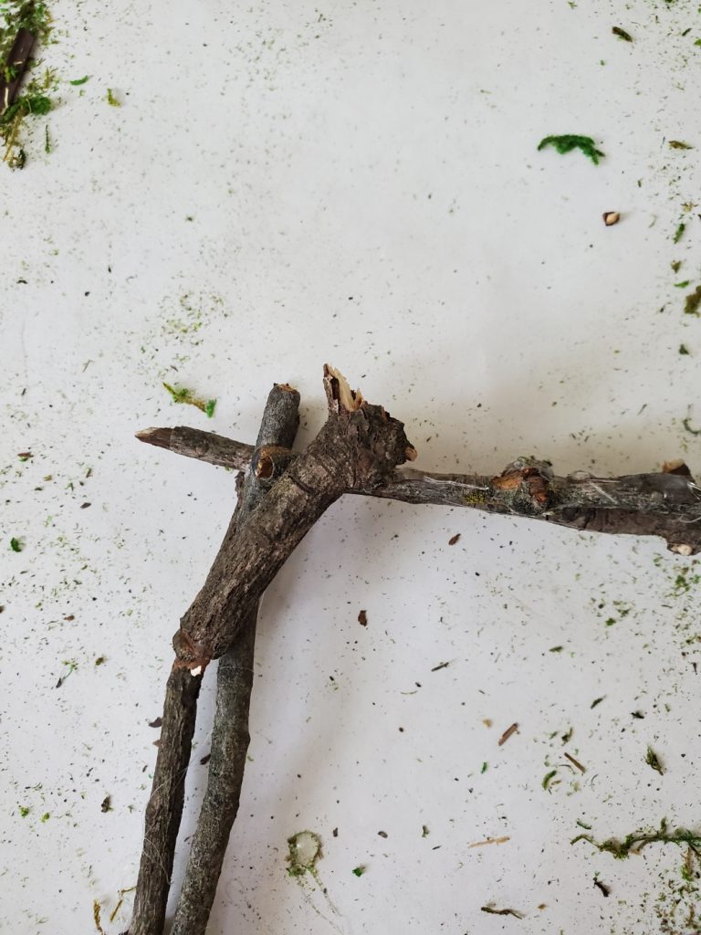 gluing small sticks on the corner to make the nest