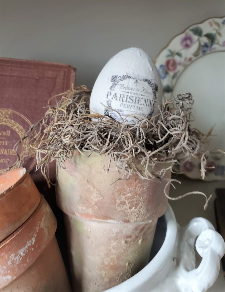 Easter Egg and Bunny Crafts again inside a flower pot with Spanish moss
