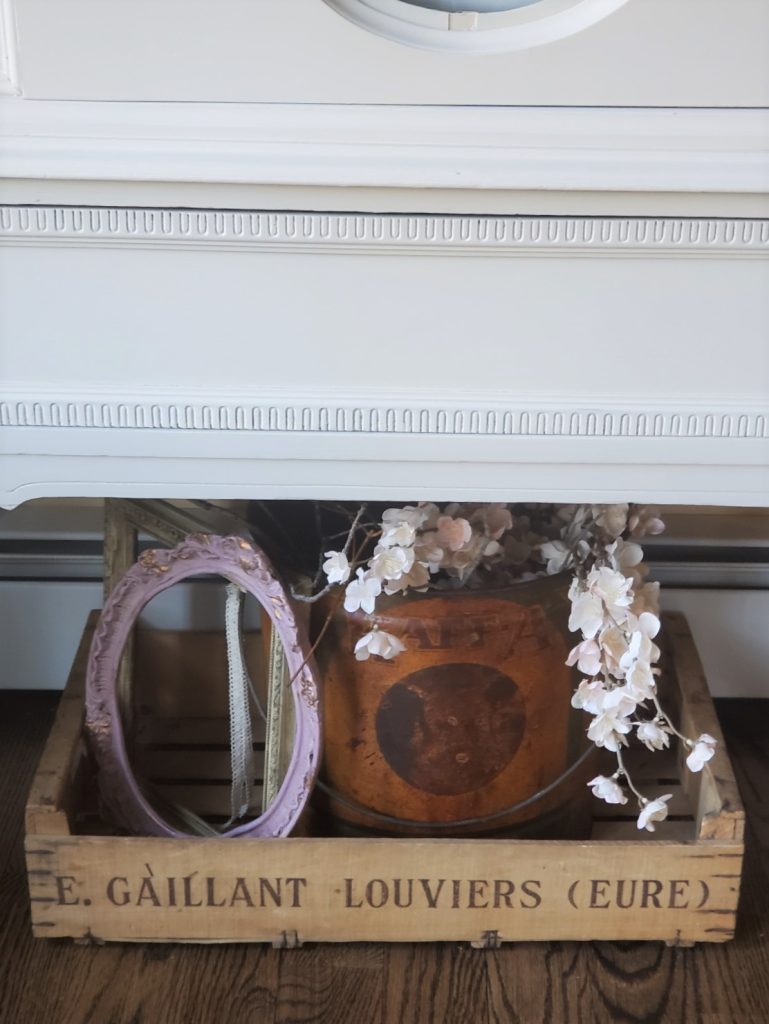 cherry blossoms and a bucket with a small frame for the simple spring home tour