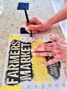 stenciling-white-paint-on-stars