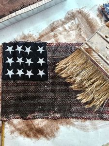 diy-patriotic-flags-with-vintage-style.-me-finishing-adding-dye-to-stripes