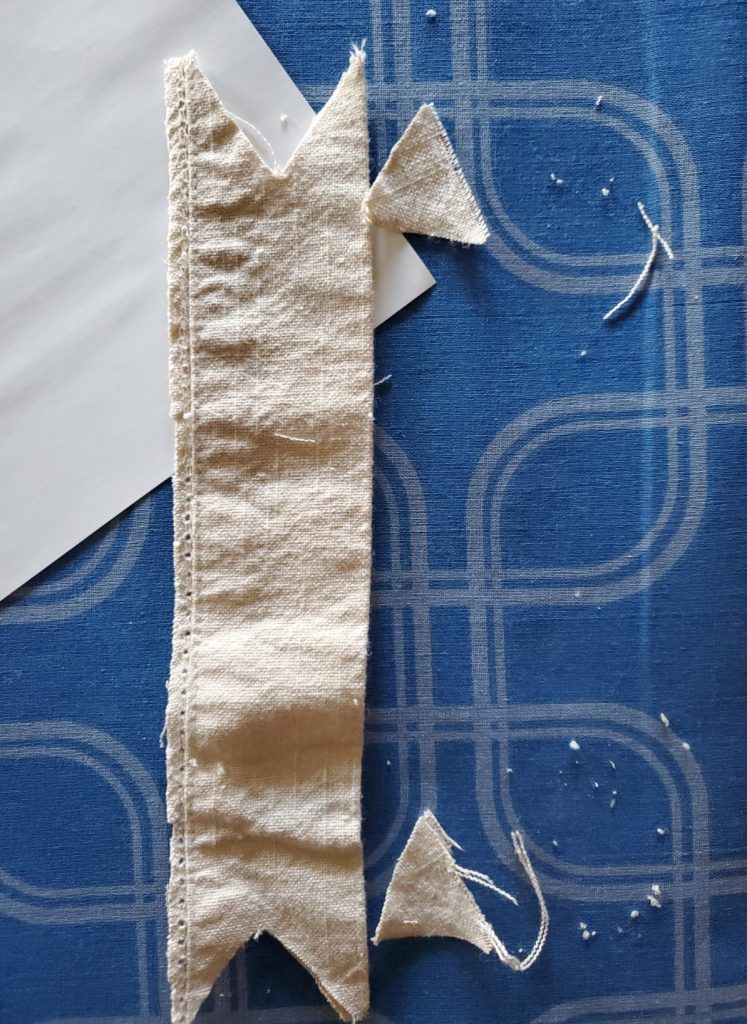 Christmas wreath banner getting cut to shape