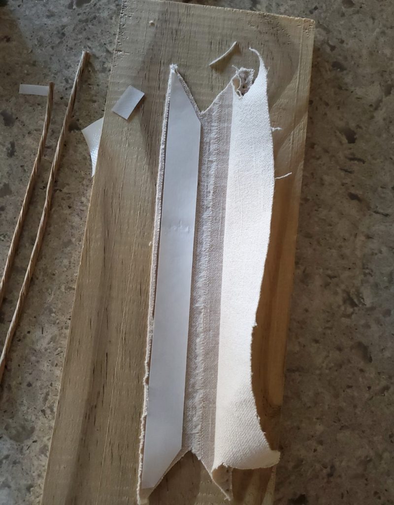 Heat N Bond getting cut to size to seal banner