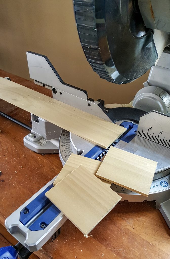 The wood beginning to get cut into a square