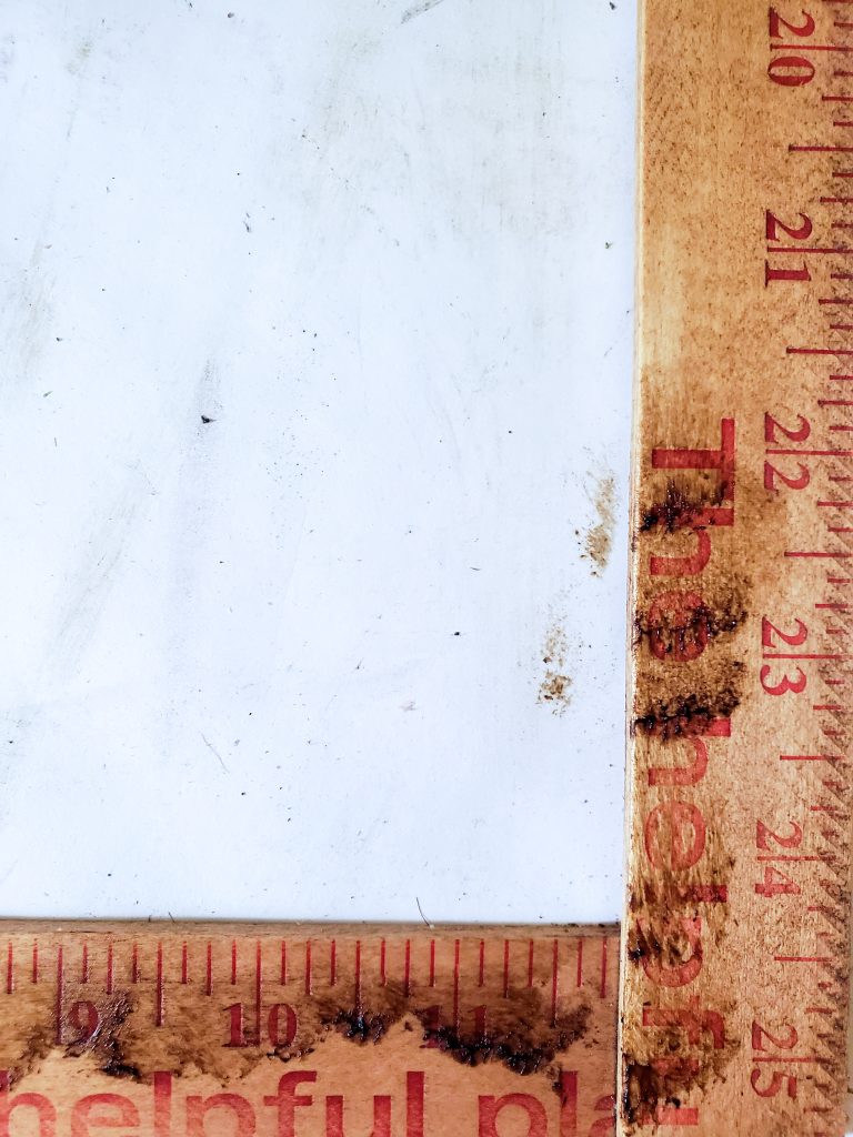 showing extra dark wax in certain areas