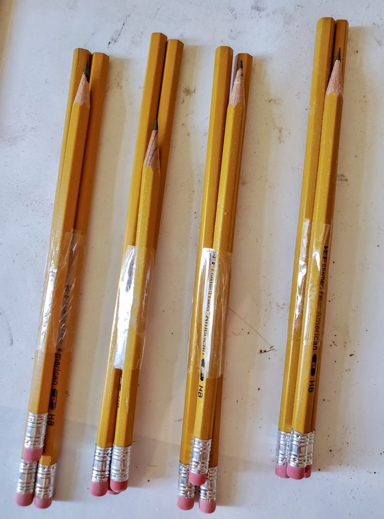 three pencils stacked together and taped for my project