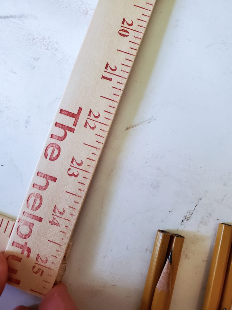 yard sticks getting glued together