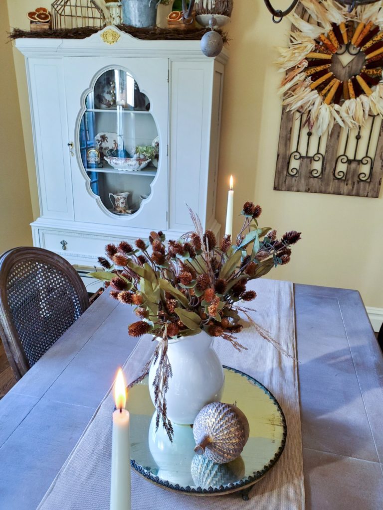Kitchen table.  showing the outside of the kitchen hutch and fall decor