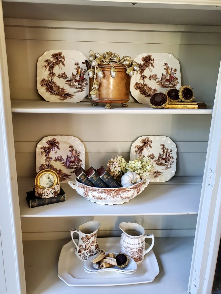 close up of the inside of the hutch showing natural fall decor