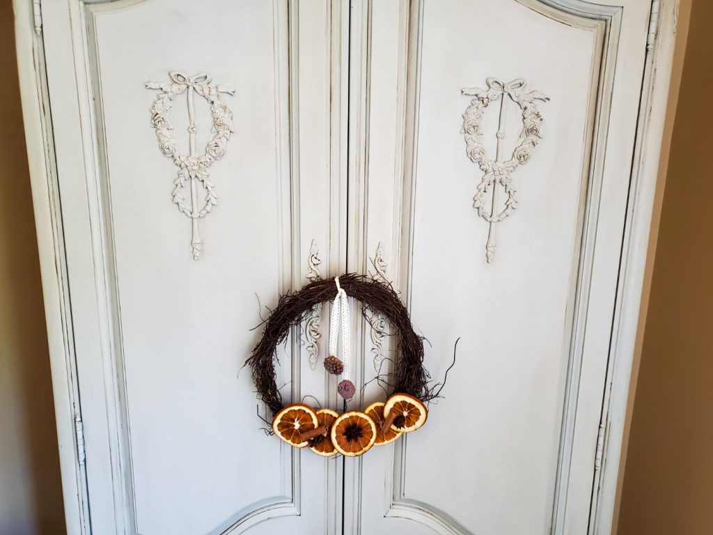 close up of French armoire doors and a wreath