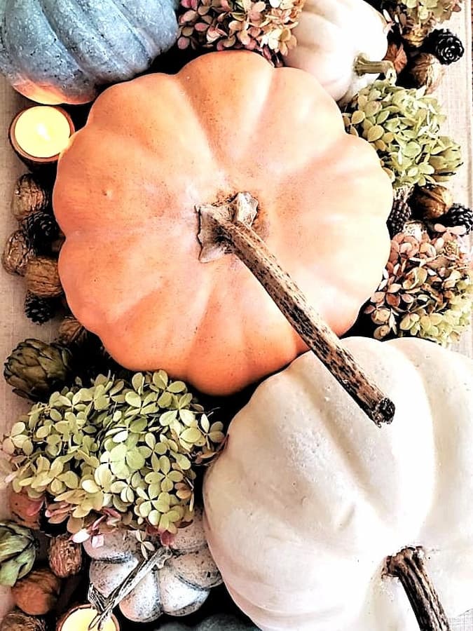 chalk-paint-on-pumpkins-is-a-sustainable-choice-pumpkins-with-hydrangeas-and-candles-featured-image