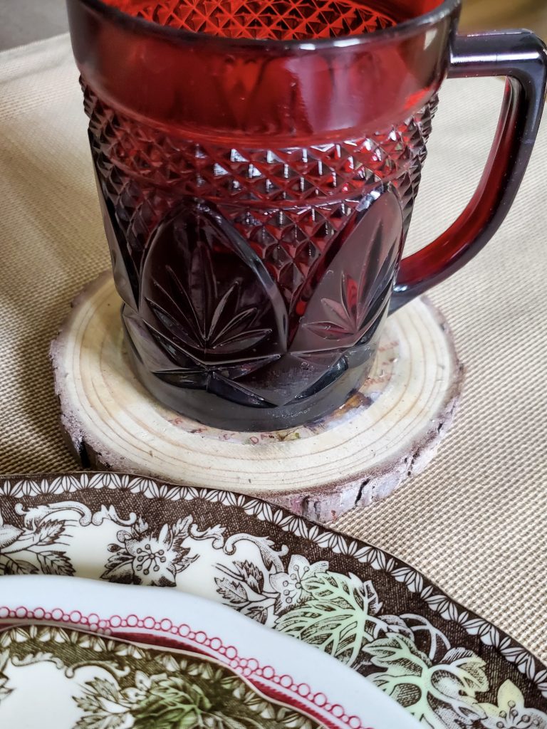 Red mug sitting on the DIY wood coasters