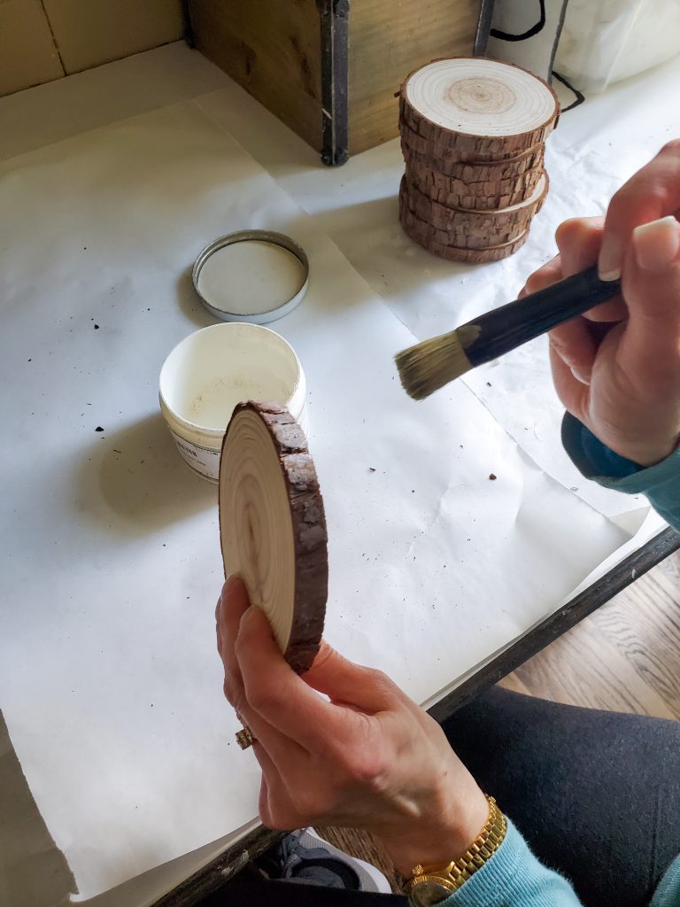 after adding white wax to the bark on the sides of the DIY wood coasters