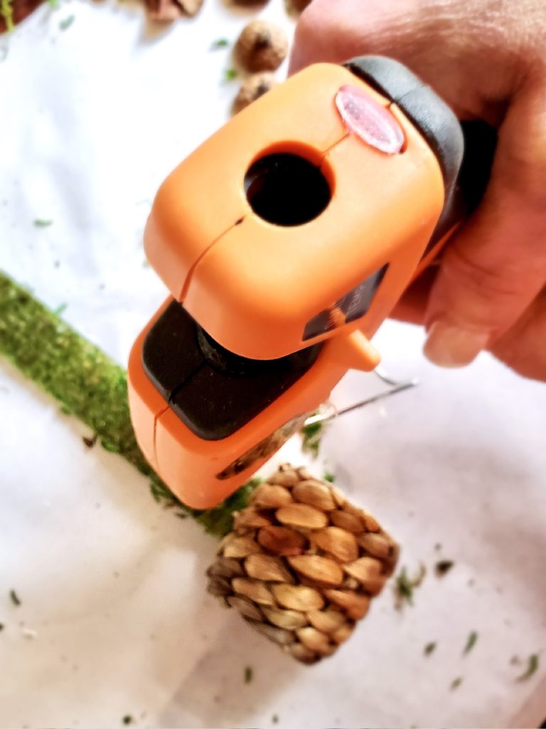 adding-a-little-hot-glue-to-moss