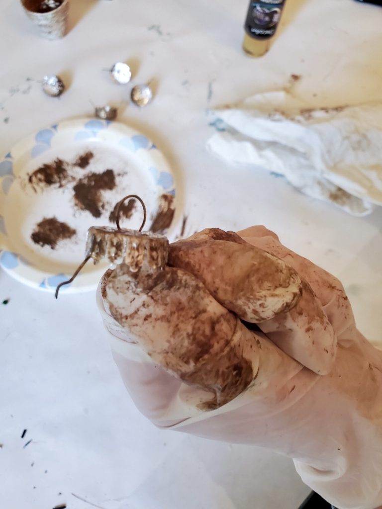 showingthe brown paint on the christmas ball top