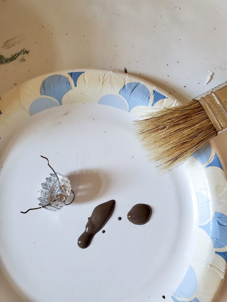 showing the paint I add to age the ball top with brown paint