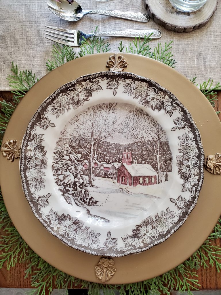a close up of the dinner plate and charger