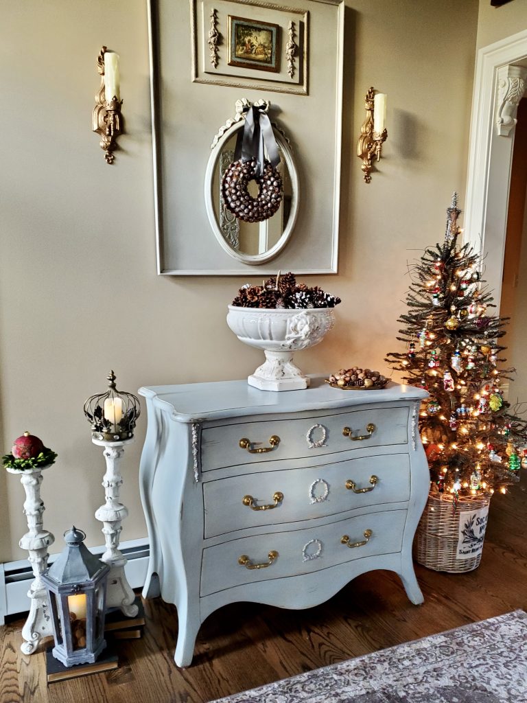 our foyer decorated for christmas which is next to crhistmas time in the dining room