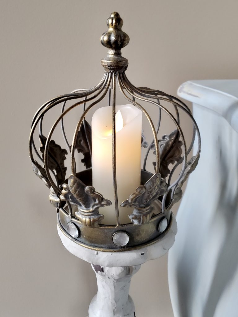 clse up of a crown with a battery operated candle