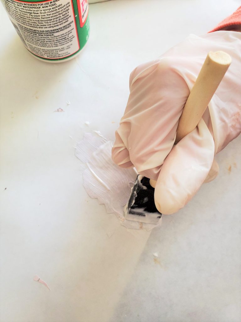 adding Mode Podge to the back of my image to add to my easy elegant Valentine DIY
