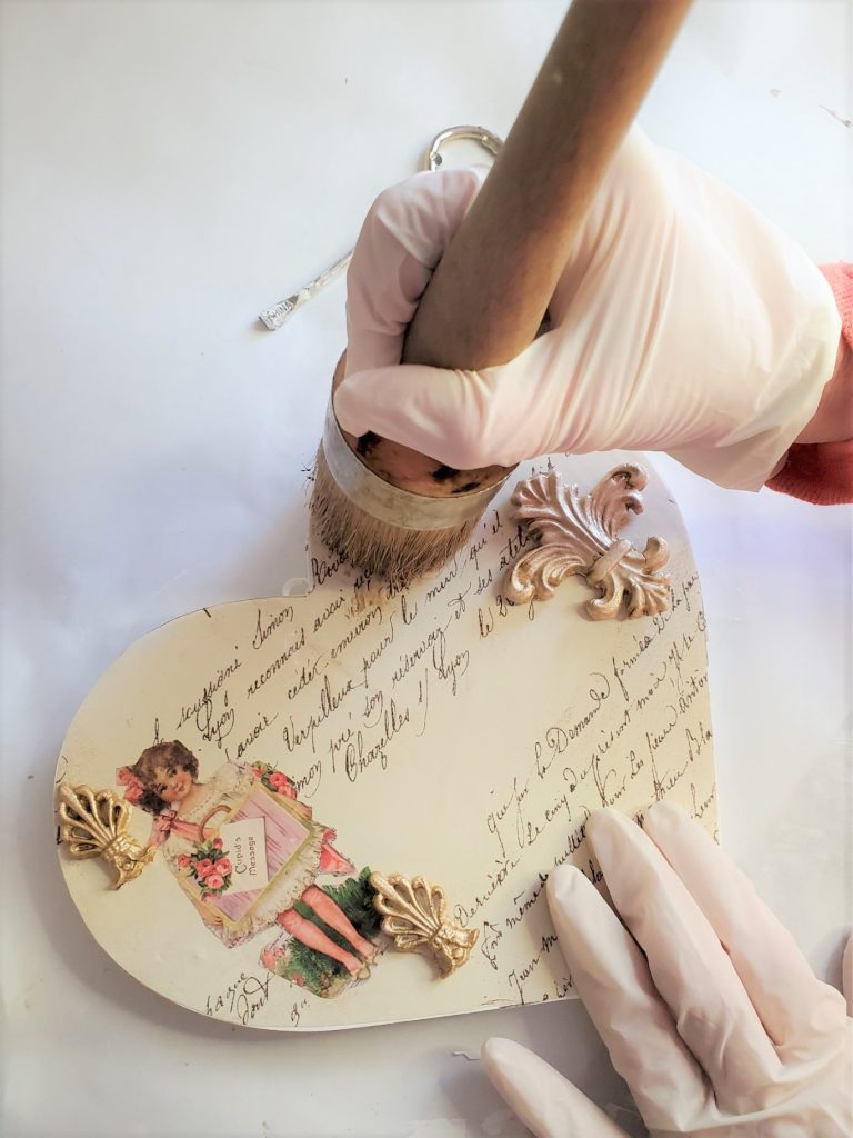 applying dark wax to my easy elegant Valentine DIY