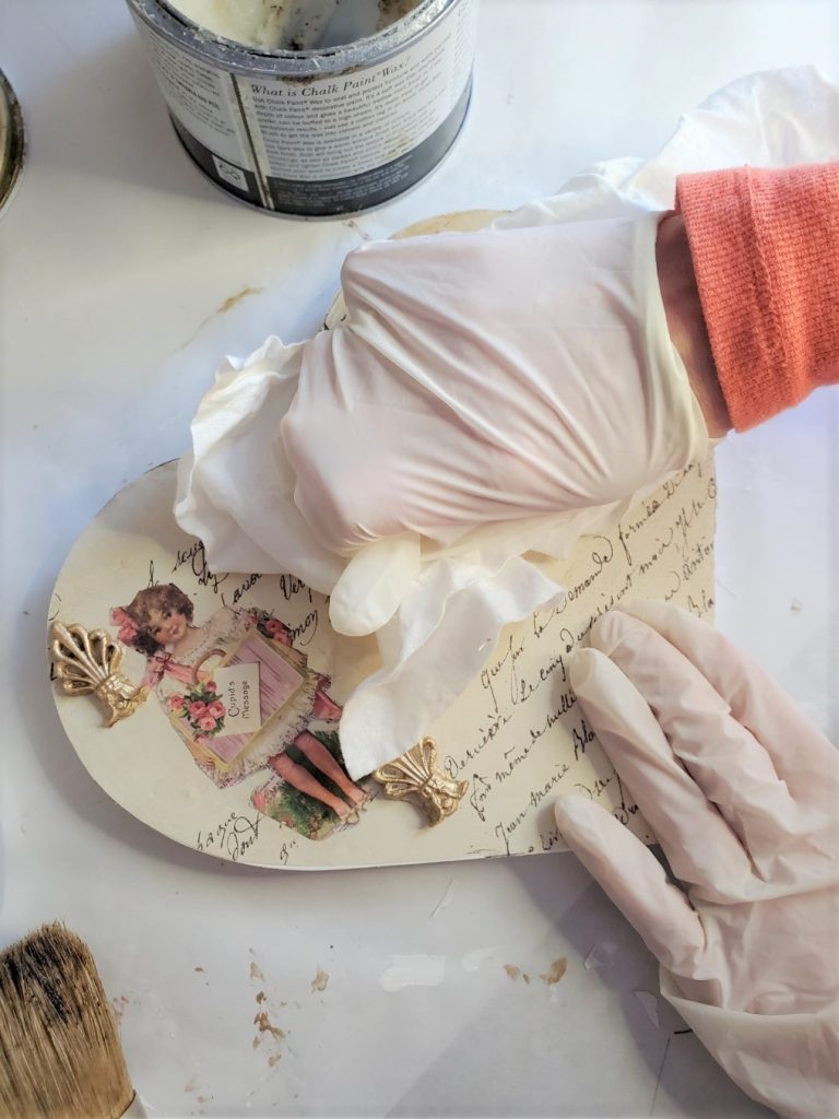 rubbing the wax in with a rag on my easy elegant Valentine DIY