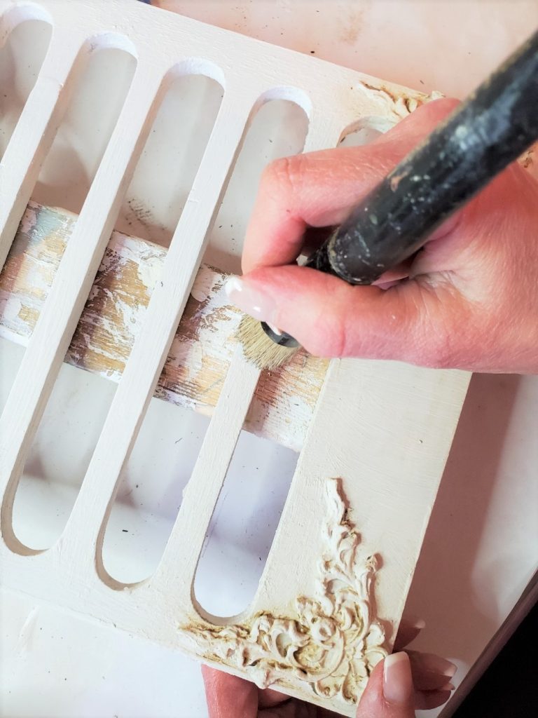 adding clear wax to the project