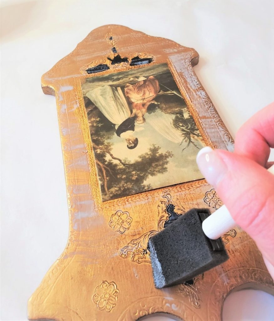 applying the adhesive so I can add the gold leafing