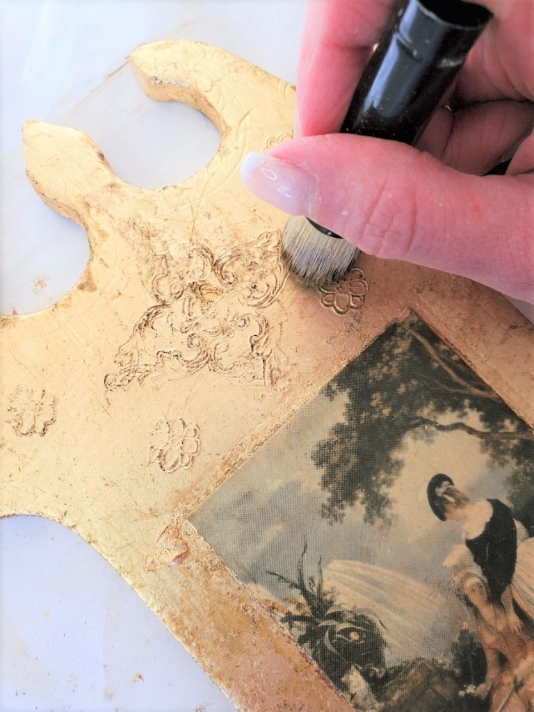 adding dark wax to the plaque