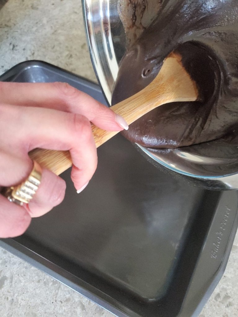 adding the batter to the pan