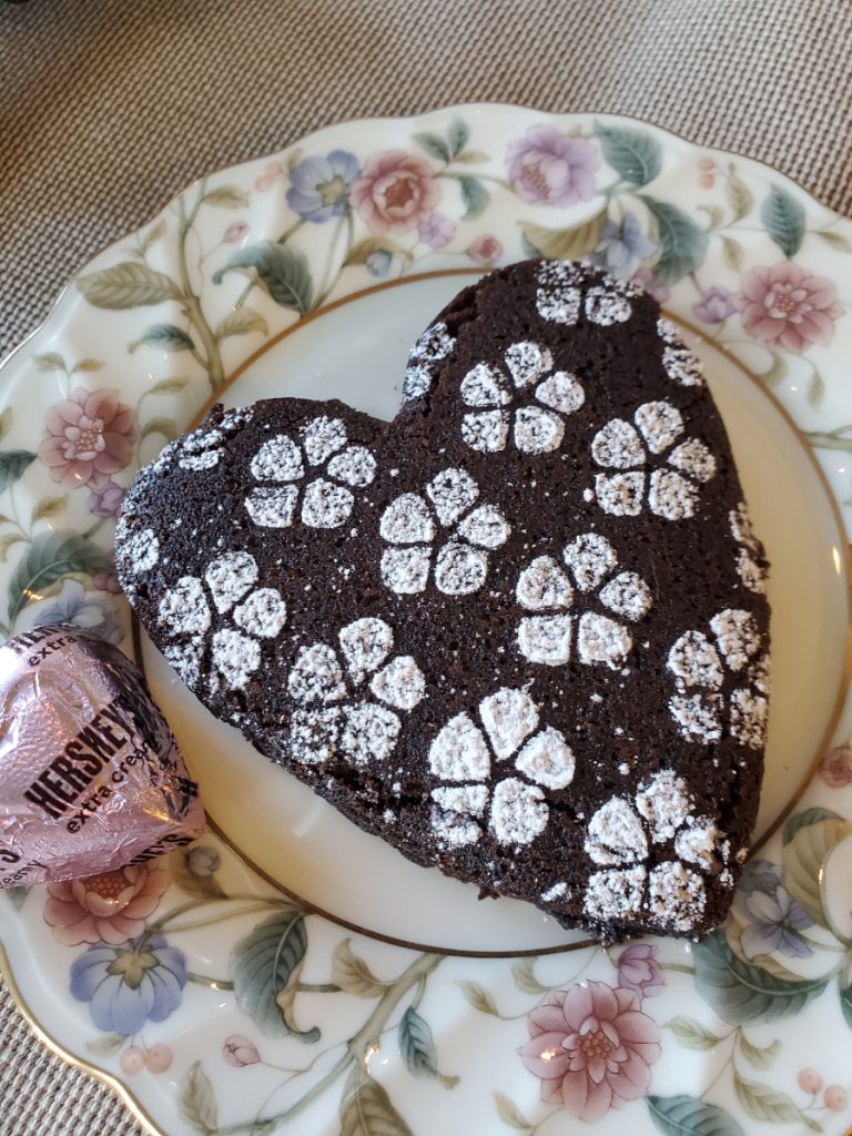 Easy Heart Shape Chocolate Brownies on a small floral dessert china dish