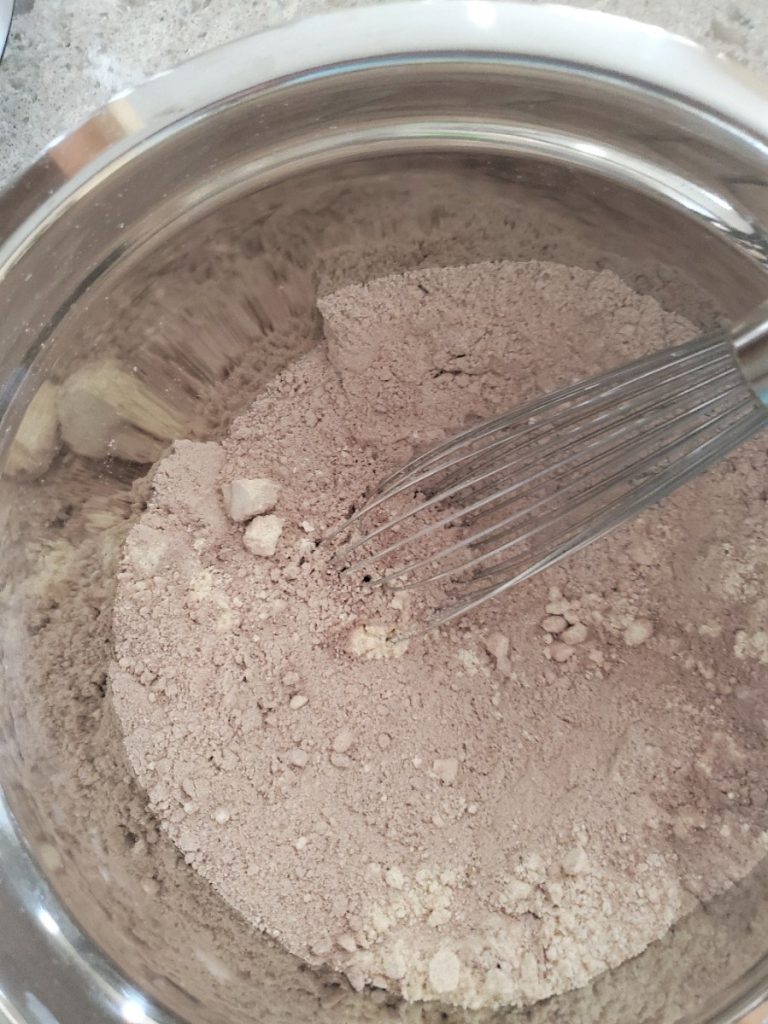 Easy Chocolate Peanut Butter Chip Cookies combine ingredients with a whisk
