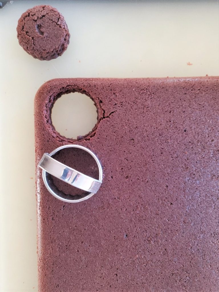 brownie being cut with a small biscuit cutter