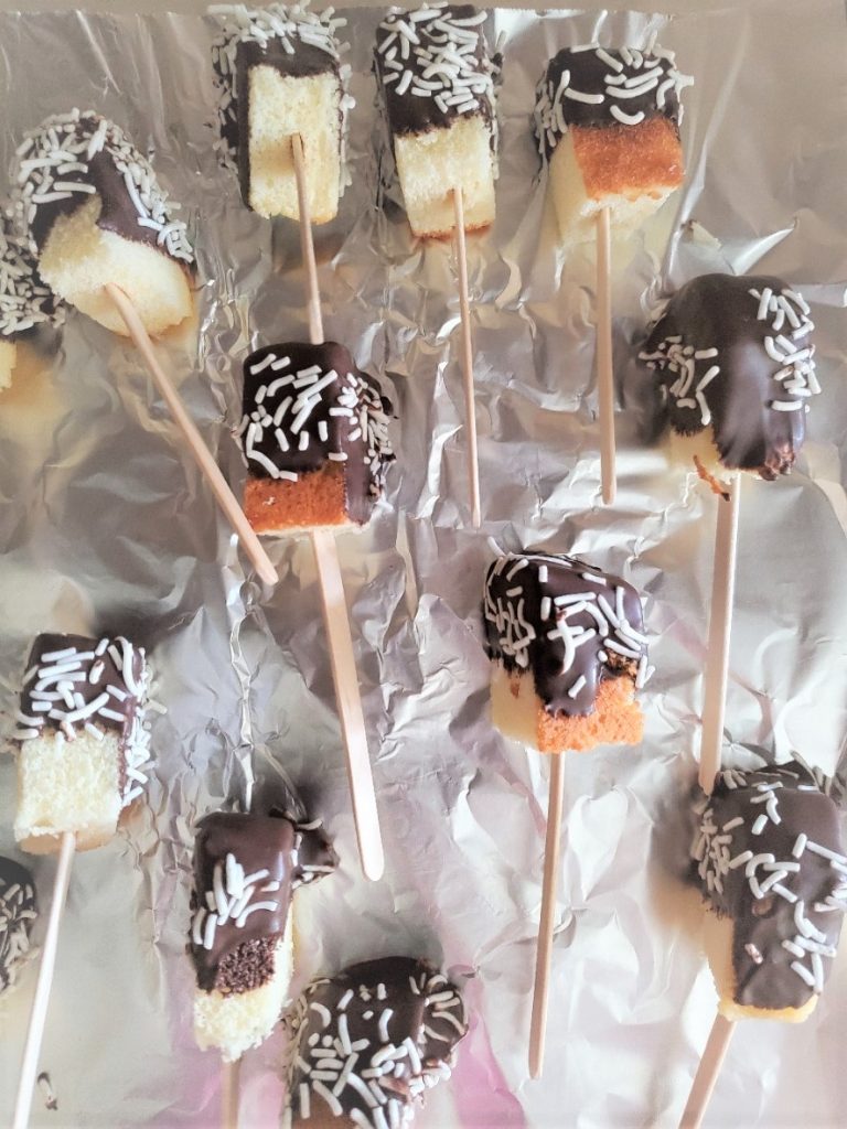 7 Easy Semi Homemade Easter Dessert Ideas pound cake pops covered in dark chocolate and sprinkles